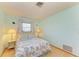 Cozy bedroom with a seashell bedding and a window at 401 Shore Rd, Nokomis, FL 34275