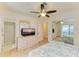 Bedroom with a dresser, TV, and en-suite bathroom at 401 Shore Rd, Nokomis, FL 34275