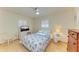 Bedroom with a full-size bed, dresser, and ceiling fan at 401 Shore Rd, Nokomis, FL 34275