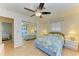 Bedroom with mirrored closet doors and a view into another bedroom at 401 Shore Rd, Nokomis, FL 34275