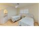 Bedroom with two twin beds and a ceiling fan at 401 Shore Rd, Nokomis, FL 34275