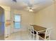 Charming dining area with wood table and chairs, near kitchen at 401 Shore Rd, Nokomis, FL 34275