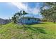 House exterior showcasing side yard and landscaping at 401 Shore Rd, Nokomis, FL 34275