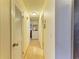 Light-filled hallway with light wood flooring at 401 Shore Rd, Nokomis, FL 34275