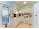 Clean and functional kitchen, featuring white cabinets and modern appliances at 401 Shore Rd, Nokomis, FL 34275