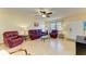 Living room with leather furniture and light wood floors at 401 Shore Rd, Nokomis, FL 34275