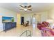 Living room with leather furniture, hardwood floors, and a view into the dining area at 401 Shore Rd, Nokomis, FL 34275