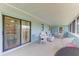 Large screened porch with access to the house interior at 401 Shore Rd, Nokomis, FL 34275