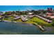 Aerial view of waterfront condos with tennis courts and beach access at 4239 Gulf Of Mexico Dr # Mh4, Longboat Key, FL 34228