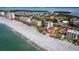 Aerial view of beachfront home with ocean and community in view at 4239 Gulf Of Mexico Dr # Mh4, Longboat Key, FL 34228