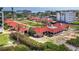 Aerial view showcasing beachfront home with red tile roof at 4239 Gulf Of Mexico Dr # Mh4, Longboat Key, FL 34228