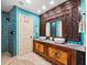 Spa-like bathroom with double vanities, large mirror, and walk-in shower at 4239 Gulf Of Mexico Dr # Mh4, Longboat Key, FL 34228