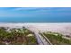 Wooden walkway to beach; chairs on pristine white sand at 4239 Gulf Of Mexico Dr # Mh4, Longboat Key, FL 34228