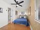 Cozy bedroom with a full-size bed and ceiling fan at 4239 Gulf Of Mexico Dr # Mh4, Longboat Key, FL 34228