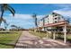 Brick path leads to Pelican Harbour building at 4239 Gulf Of Mexico Dr # Mh4, Longboat Key, FL 34228