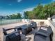 Outdoor patio with fire pit and grill at 4239 Gulf Of Mexico Dr # Mh4, Longboat Key, FL 34228