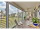 Bright lanai with sliding doors and access to outdoor space at 4350 Chatham Dr # 208, Longboat Key, FL 34228