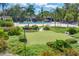 Community putting green next to the pool and patio area at 4350 Chatham Dr # 208, Longboat Key, FL 34228