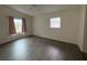 Spacious bedroom with wood-look floors and large window at 4527 Fern Dr # 26, Bradenton, FL 34208