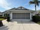 Gray house with two car garage and landscaped front yard at 4527 Fern Dr # 26, Bradenton, FL 34208