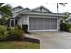 Two-car garage with screened enclosure and a spacious driveway at 4527 Fern Dr # 26, Bradenton, FL 34208