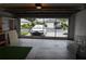 Garage with screen door and car at 4527 Fern Dr # 26, Bradenton, FL 34208