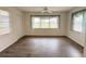 Bright living room with wood-look floors and access to the outdoors at 4527 Fern Dr # 26, Bradenton, FL 34208