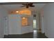 Living room with vaulted ceiling, wood-look floors and kitchen access at 4527 Fern Dr # 26, Bradenton, FL 34208