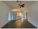 Open living room with wood-look floors and kitchen bar at 4527 Fern Dr # 26, Bradenton, FL 34208