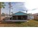 Back of house featuring a screened patio and a fenced yard at 4534 Pike Ave, Sarasota, FL 34233