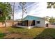 View of backyard with screened patio and grassy area at 4534 Pike Ave, Sarasota, FL 34233