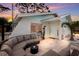 Evening view of front entry with seating area and landscaping at 4534 Pike Ave, Sarasota, FL 34233