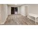 Living room with wood-look floors and white console table at 4534 Pike Ave, Sarasota, FL 34233