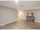 Bright living room featuring hardwood floors and a modern entertainment center at 4534 Pike Ave, Sarasota, FL 34233