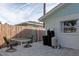 Small patio with table and chairs adjacent to the house at 4534 Pike Ave, Sarasota, FL 34233