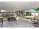 Spacious screened patio with outdoor furniture and backyard view at 4534 Pike Ave, Sarasota, FL 34233