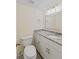 Guest bathroom boasting granite countertop and white cabinets at 4555 Forest Wood Trl # 23, Sarasota, FL 34241