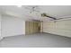 Garage with built-in storage cabinets and freshly painted floor at 4555 Forest Wood Trl # 23, Sarasota, FL 34241