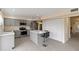 Modern kitchen with gray cabinets and a large island at 4555 Forest Wood Trl # 23, Sarasota, FL 34241