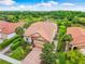 Single-story home with tile roof, brick driveway at 4653 Royal Dornoch Cir, Bradenton, FL 34211