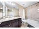 Bathroom with shower/tub combo, granite vanity, and tile floor at 4653 Royal Dornoch Cir, Bradenton, FL 34211