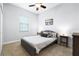 Guest bedroom with a queen bed and ceiling fan at 4653 Royal Dornoch Cir, Bradenton, FL 34211