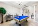 Spacious game room with a pool table and access to other rooms at 4653 Royal Dornoch Cir, Bradenton, FL 34211