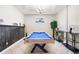 Game room features a pool table, built-in shelving, and decorative accents at 4653 Royal Dornoch Cir, Bradenton, FL 34211