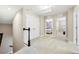 Upstairs hallway with carpet, built-in closets, and access to bedrooms at 4653 Royal Dornoch Cir, Bradenton, FL 34211