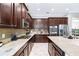 Well-equipped kitchen with granite countertops and stainless steel appliances at 4653 Royal Dornoch Cir, Bradenton, FL 34211