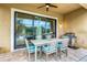 Outdoor patio with dining table and grill at 4653 Royal Dornoch Cir, Bradenton, FL 34211