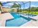 Relaxing screened pool and spa with patio furniture at 4653 Royal Dornoch Cir, Bradenton, FL 34211