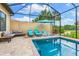 Screened pool and spa with lounge chairs at 4653 Royal Dornoch Cir, Bradenton, FL 34211