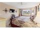 Main bedroom with a king bed and views to the canal at 4714 Potomac Cir, Bradenton, FL 34210